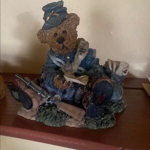 Blue and Brown Bear Sculpture in Uniform